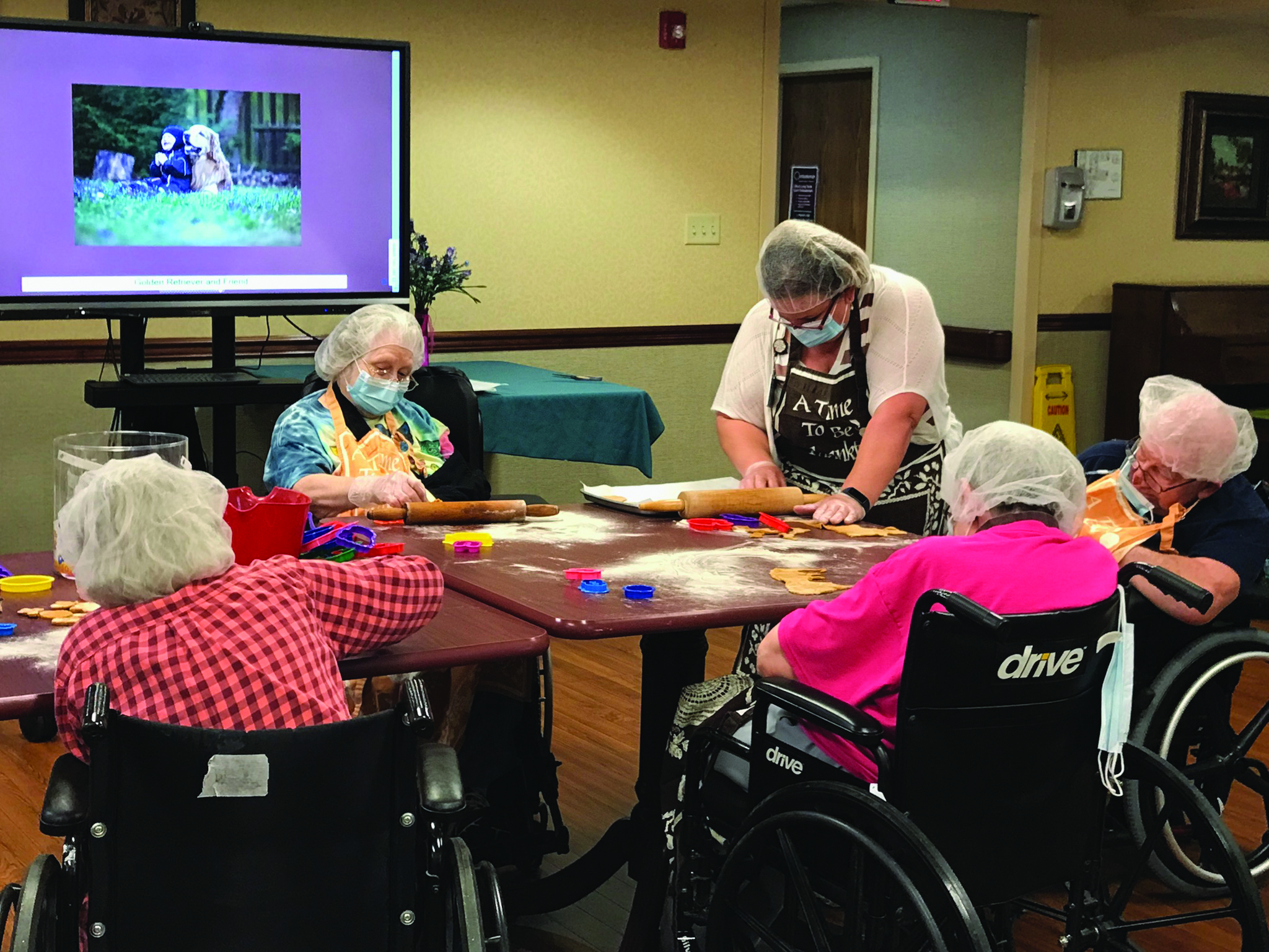 The Harmar Place Community residents participate in a group activity with iN2L technology.