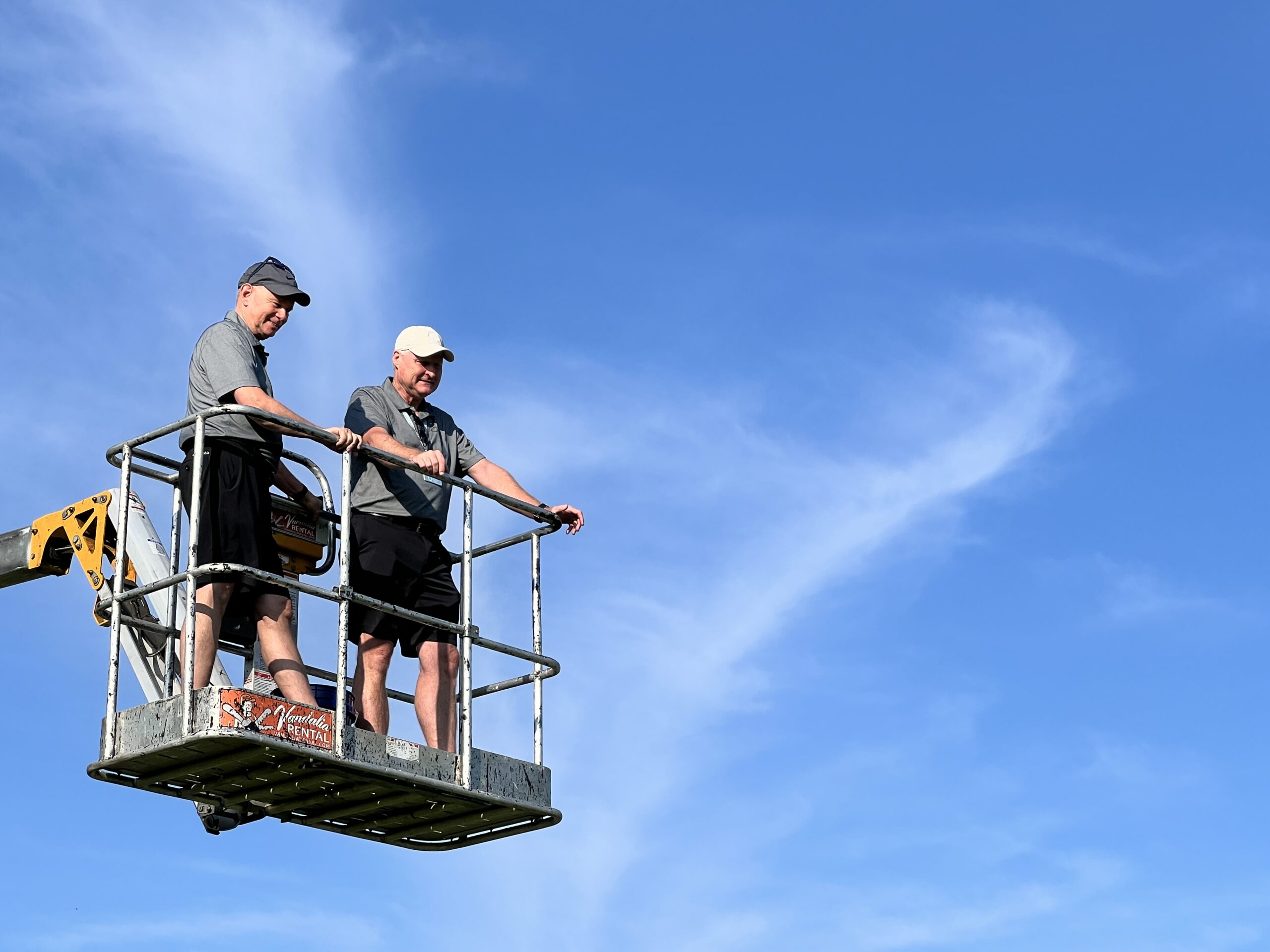 Rev. Daniel and ken Young facilitating the ball drop at the annual golf outing in celebration of The Trinity Community at Beavercreek's 50th anniversary.