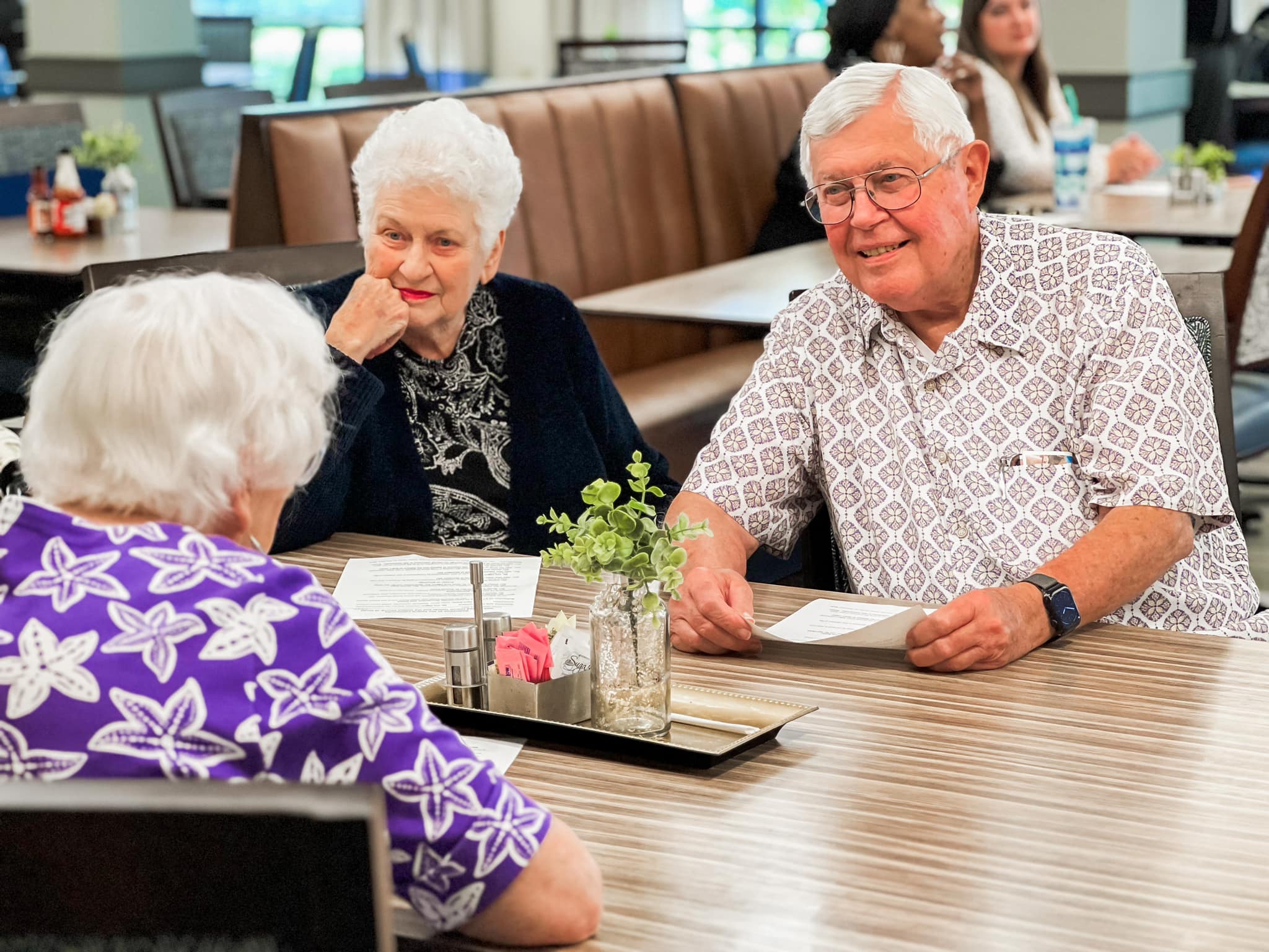 Event attendees sitting and talking.