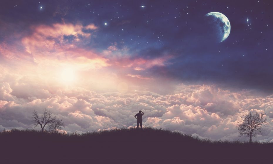 A person stands on a hilltop, silhouetted against a sky filled with clouds, a bright moon, and scattered stars at dusk.
