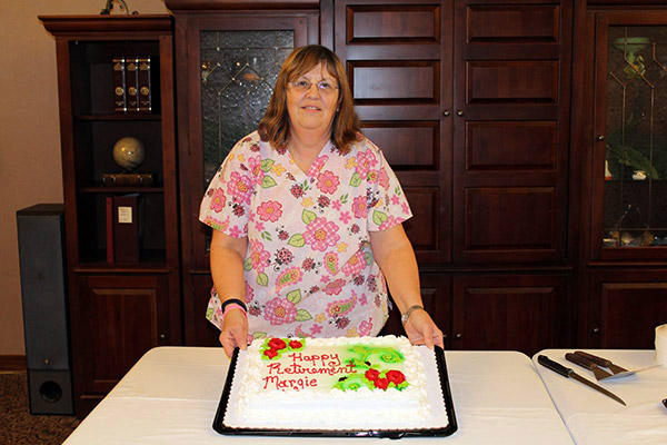 Margie Young celebrating her retirement with a cake