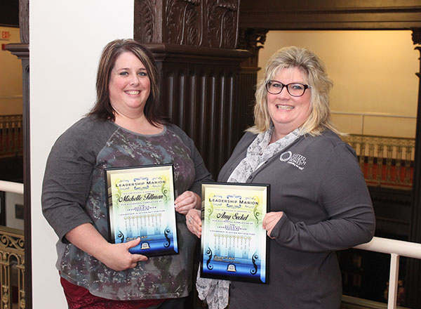 Amy Seckel and Michelle Tillman pose with their certificates.