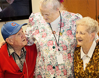 An image of a caregiver with residents.