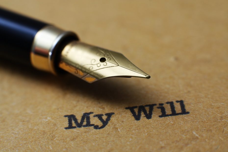 A close-up of a fountain pen's nib resting on a document titled "My Will".